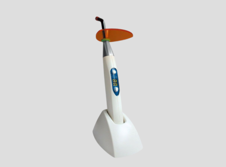 Dental light cure unit for polymerization of composite materials